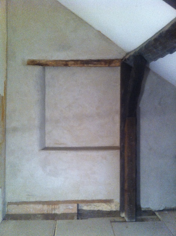 Unpainted lime plaster with false window